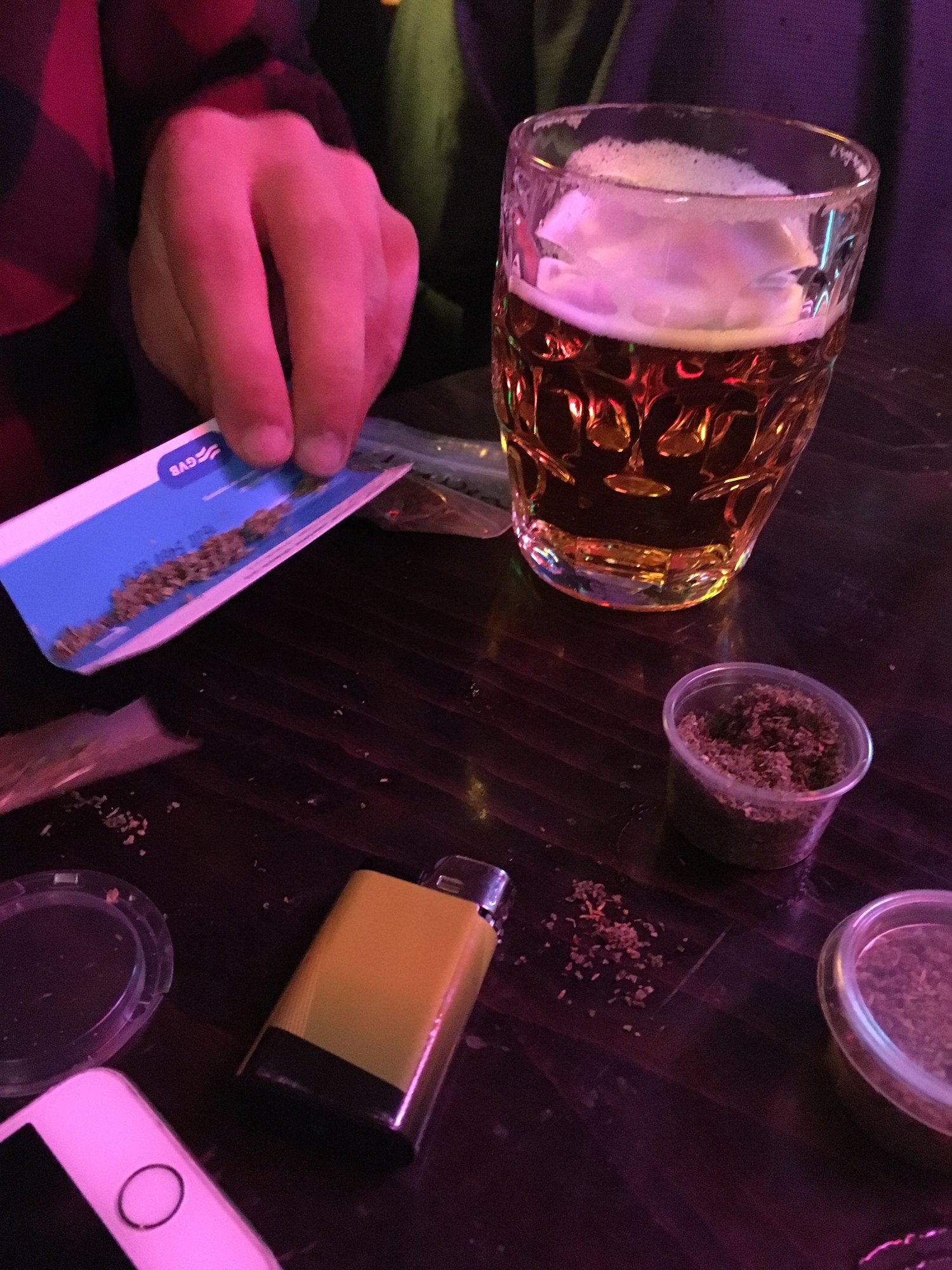 A beer and a table full of things to escape with